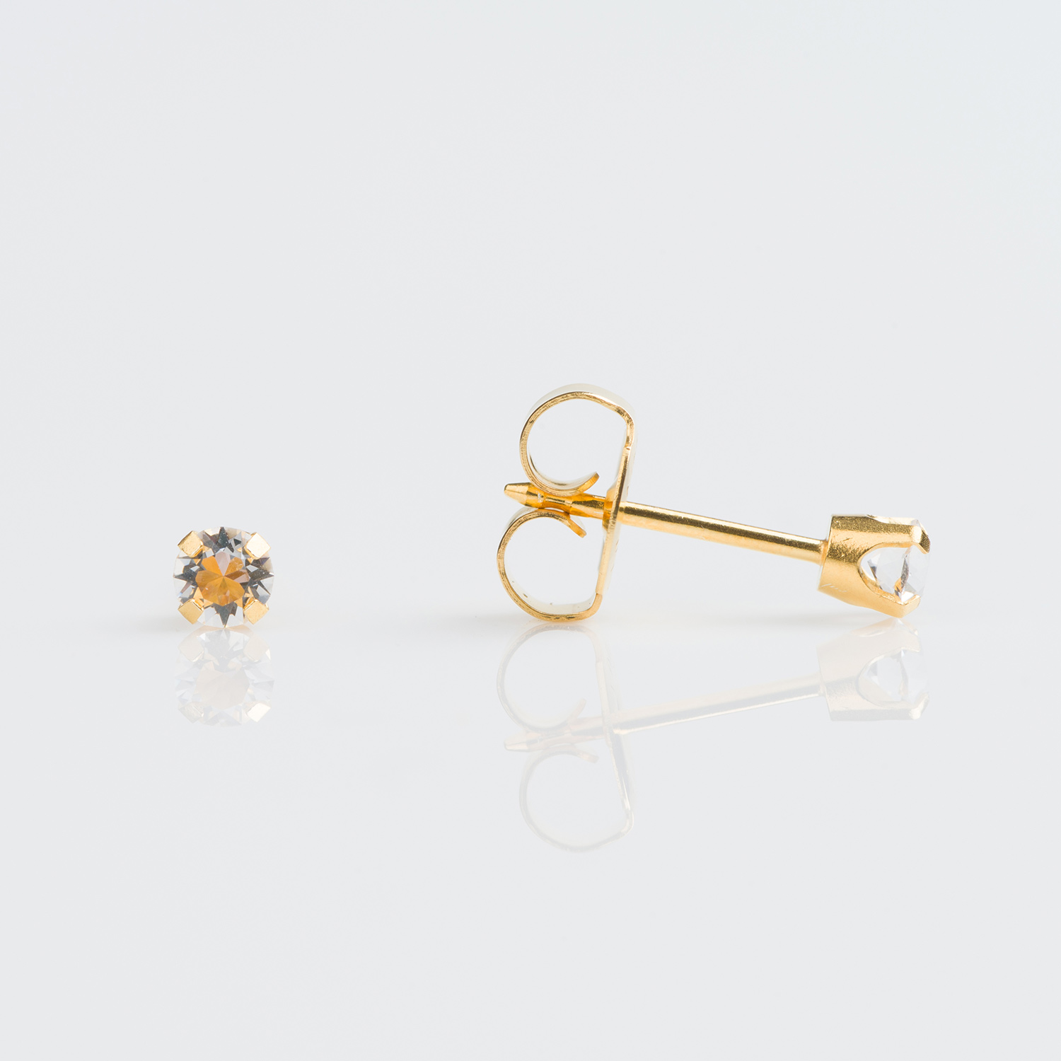 System 75™ Prong-Set Birthstone Piercing Studs – 3mm – April Clear Crystal – 9K Yellow Gold
