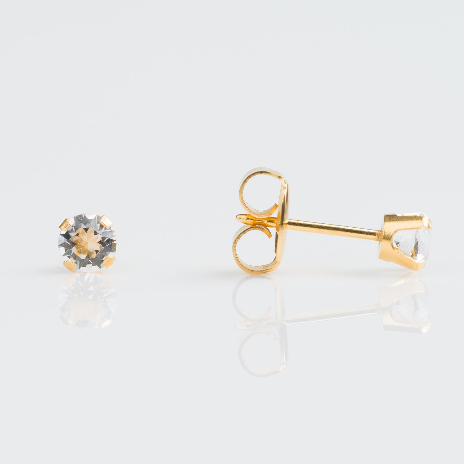 System 75™ Prong-Set Birthstone Piercing Studs – 4mm – April Clear Crystal – 9K Yellow Gold