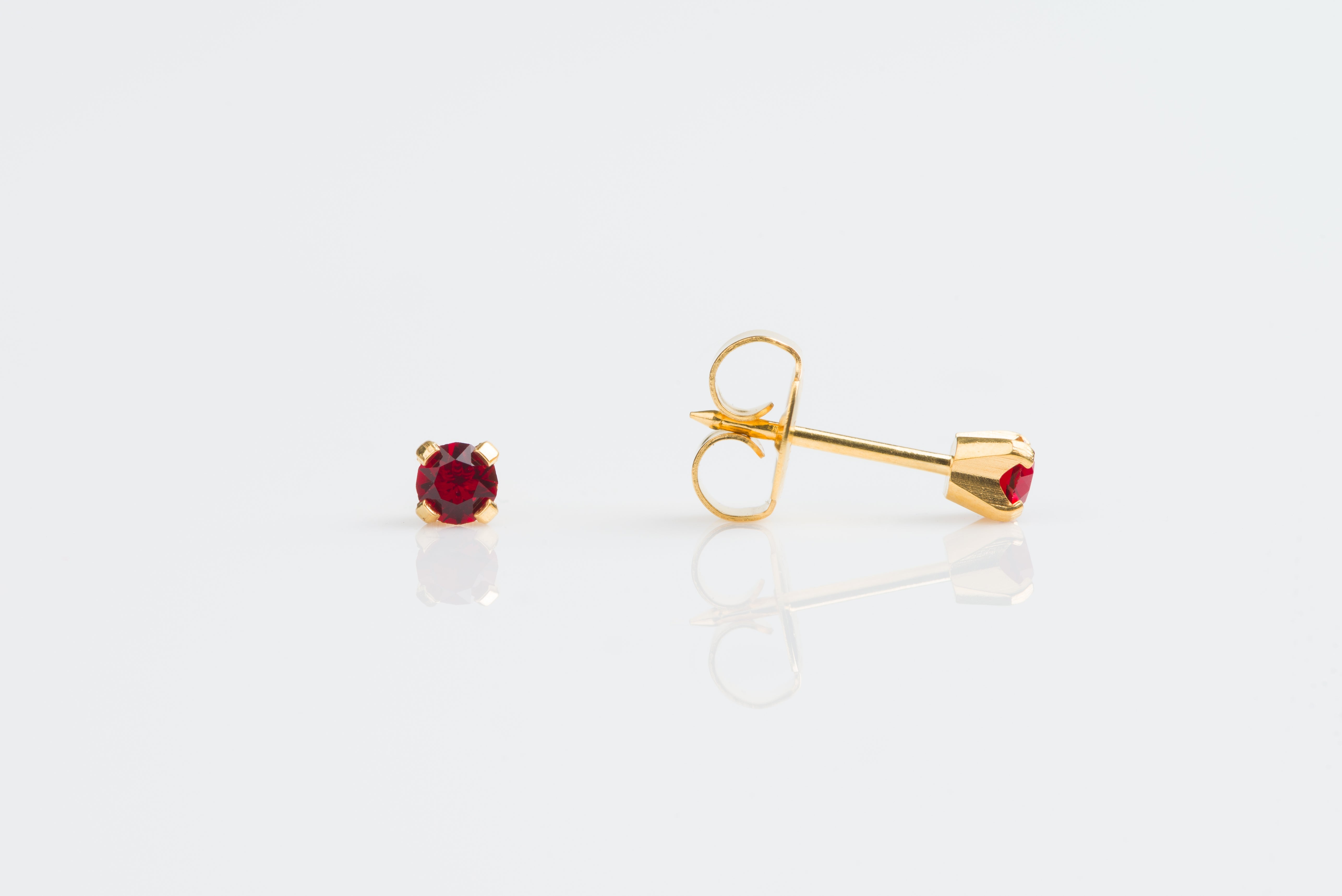 System 75™ Prong-Set Birthstone Piercing Studs – 3mm – January Garnet Crystal – 14K Yellow Gold