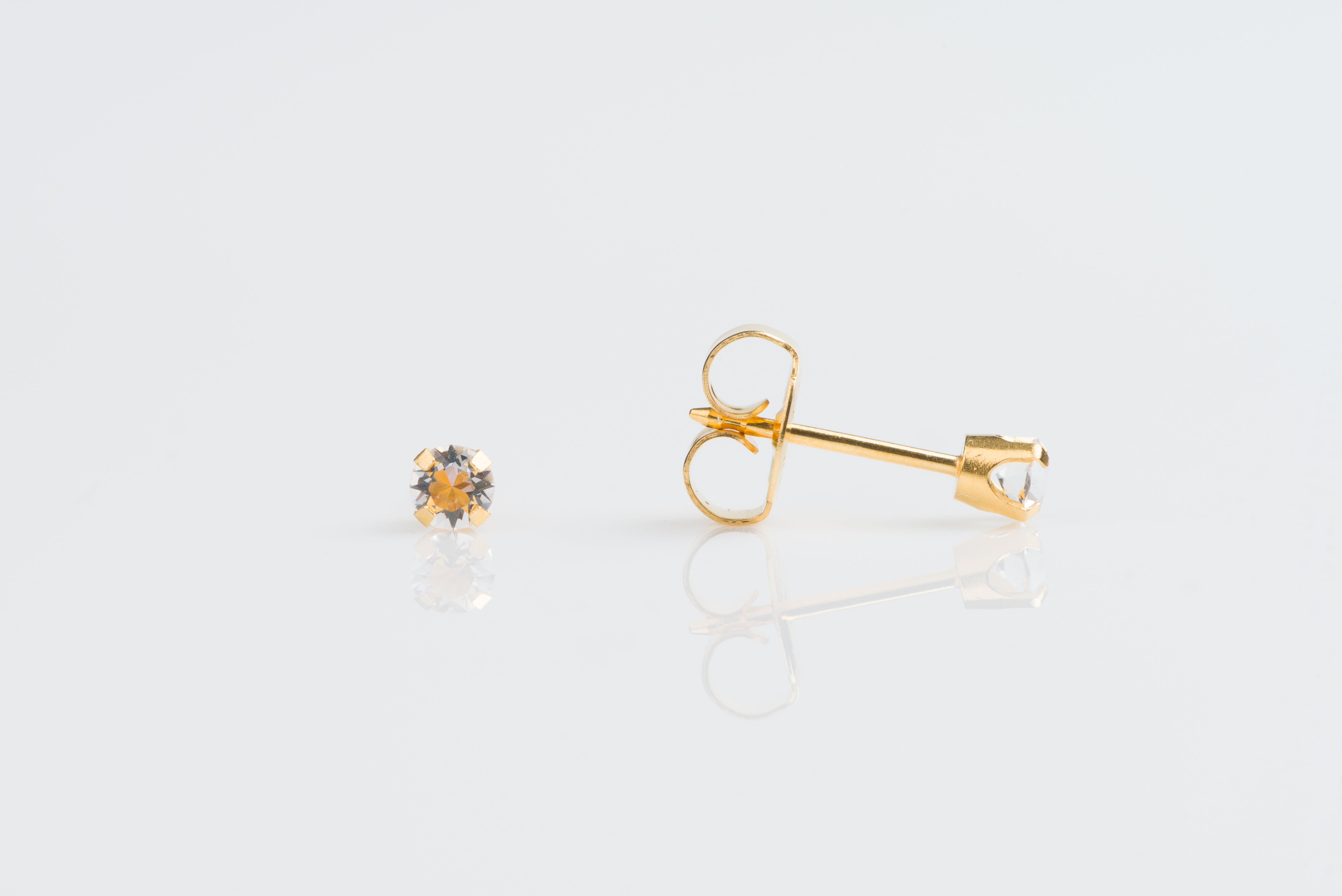 System 75™ Prong-Set Birthstone Piercing Studs – 3mm – April Clear Crystal – 14K Yellow Gold