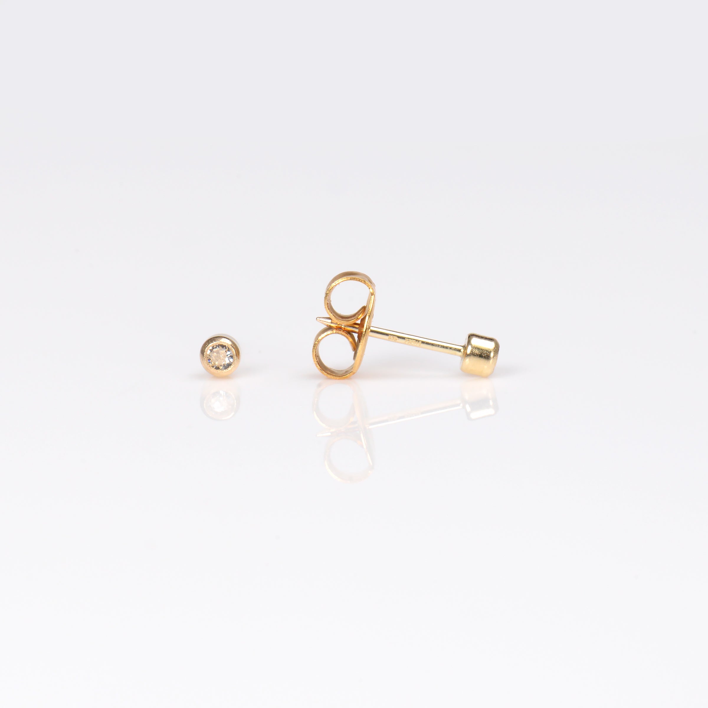 System 75™ Bezel-Set Birthstone Piercing Studs – 2mm – April Clear Crystal – 14K Yellow Gold