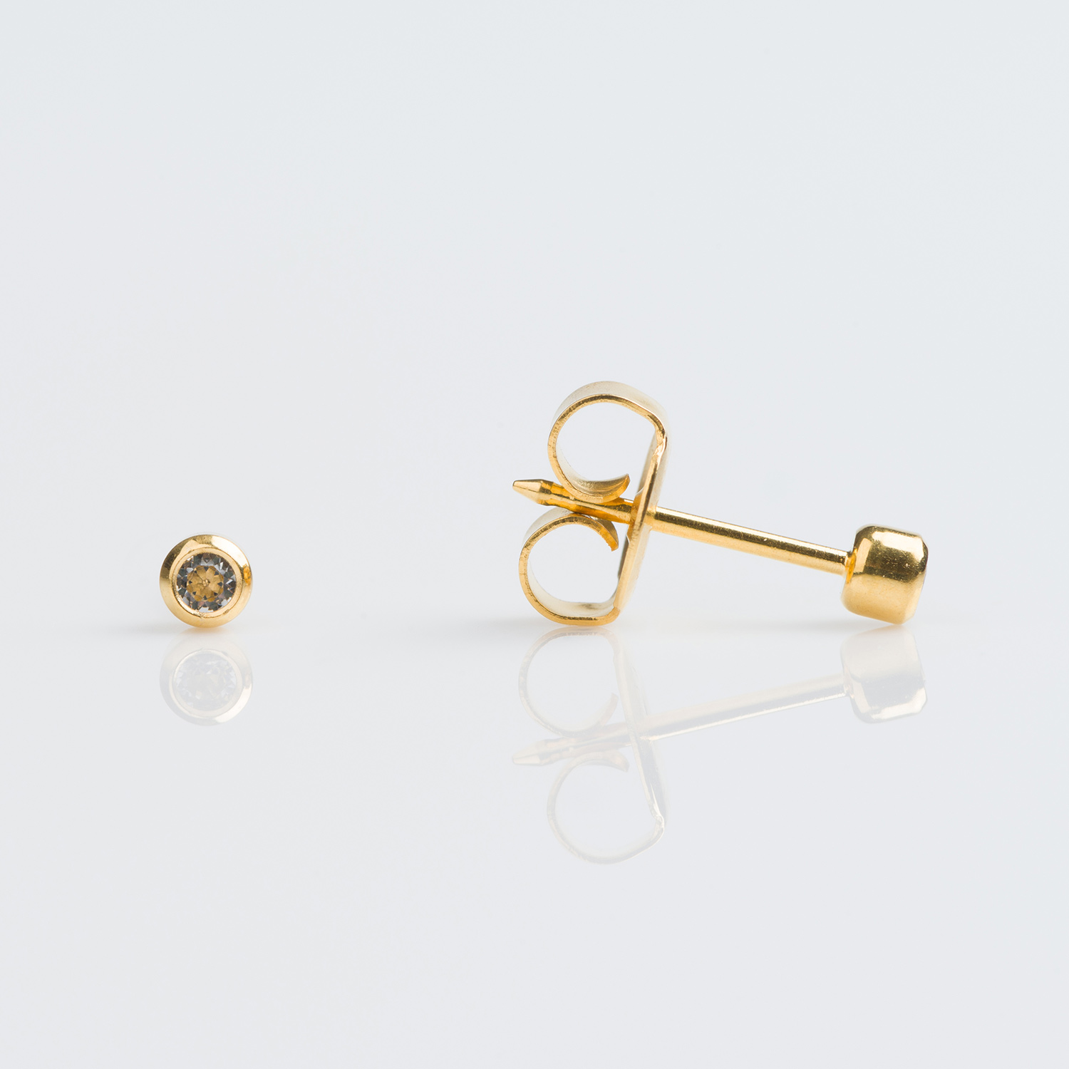 System 75™ Bezel-Set Birthstone Piercing Studs – 2mm – April Clear Crystal – Gold-Plated