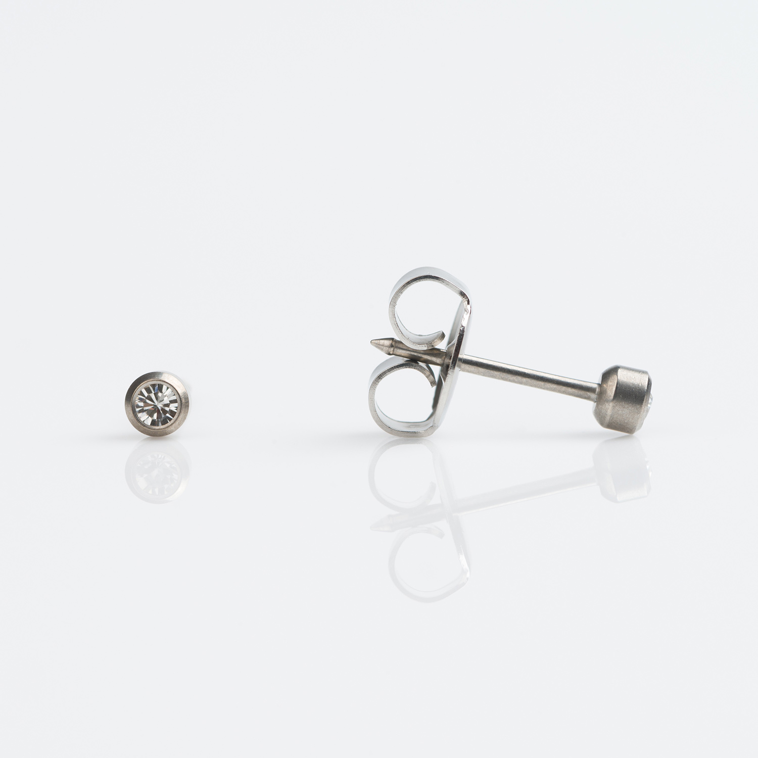 System 75™ Bezel-Set Birthstone Piercing Studs – 2mm – April Clear Crystal – Titanium
