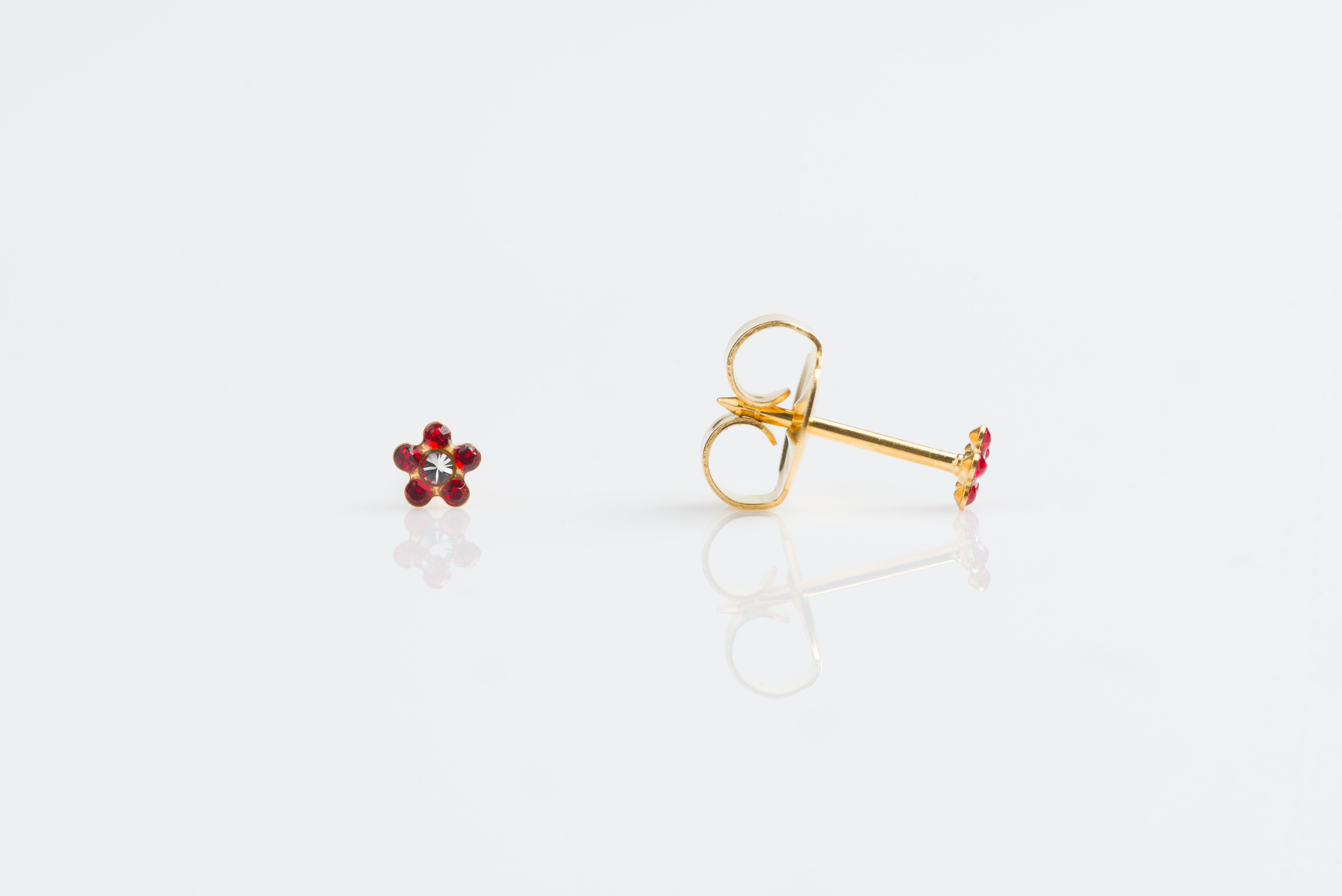 System 75™ Daisy Birthstone Piercing Studs – July Ruby + April Crystal – Baby Post – Gold-Plated